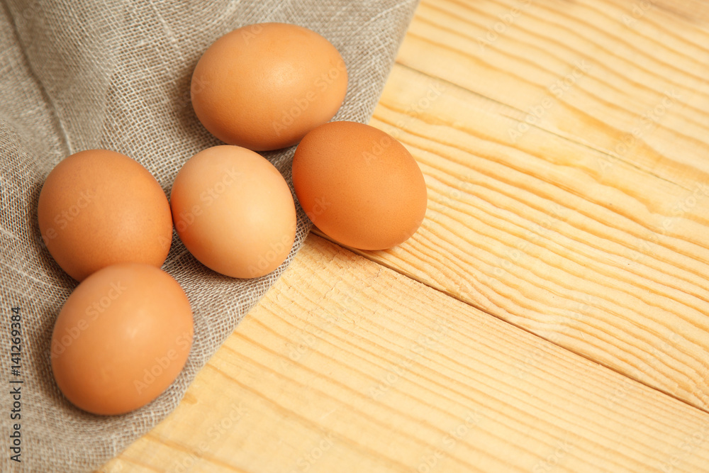 fresh farm eggs on sackcloth rustic background. fresh farm eggs on sackcloth rustic background.