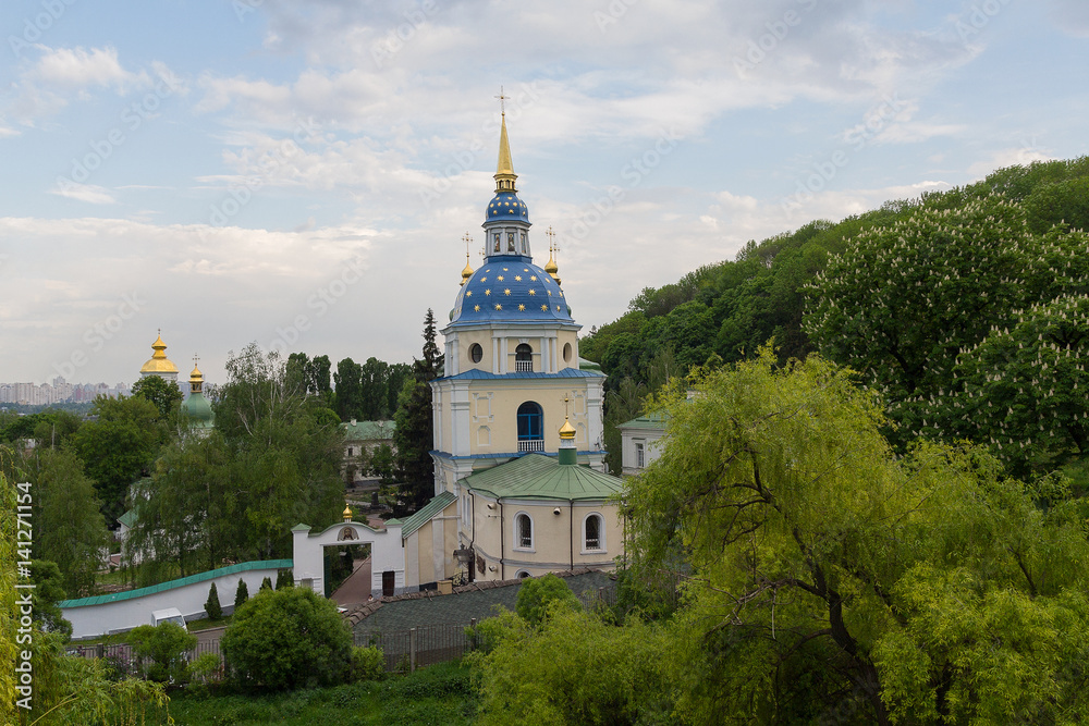 View of the Vydubychi monastery among the trees. Kiev, Ukraine