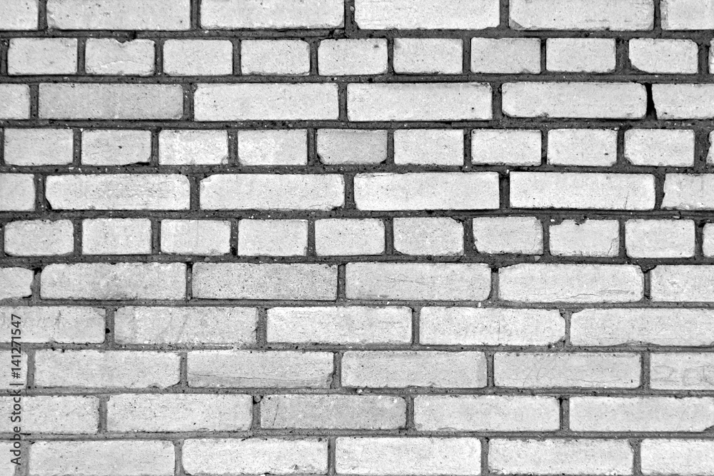 Gray color grungy brick wall pattern.