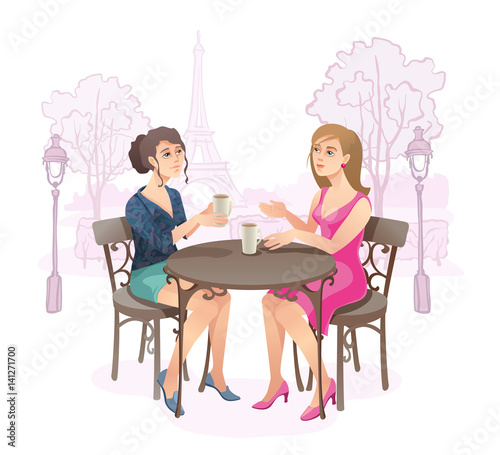 Girls in street cafe.