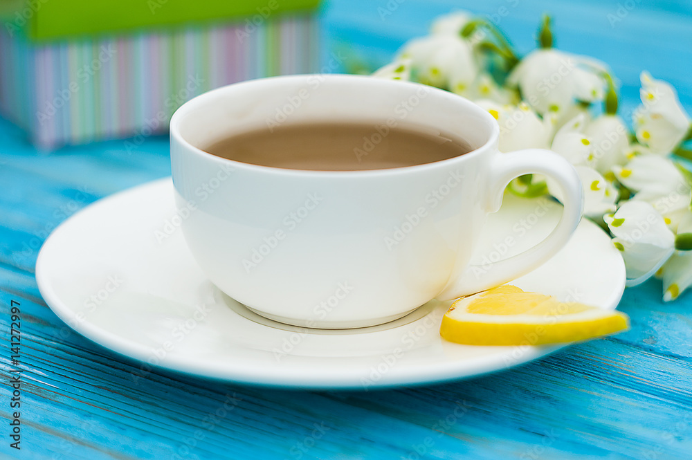 Spring breakfast hot tea and a bouquet of snowdrops Spring breakfast hot tea and a bouquet of snowdrops