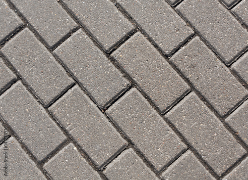Gray color cobblestone pavement close-up