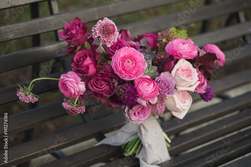 Beautiful wedding bouquet. Pink roses and other flowers.