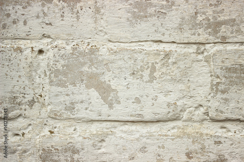 Old brick wall of white color closeup