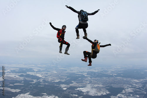 Skydivers make fun in the sky.