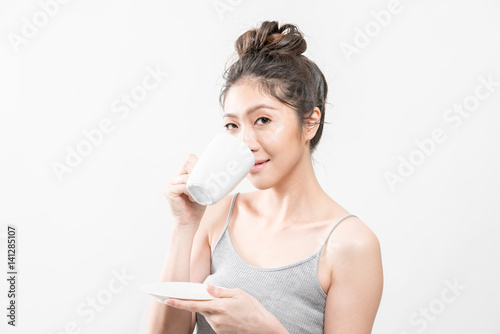 Asian young beautiful woman drinking coffee.