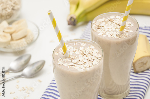 Milk shake with banana and oatmeal, healthy breakfast