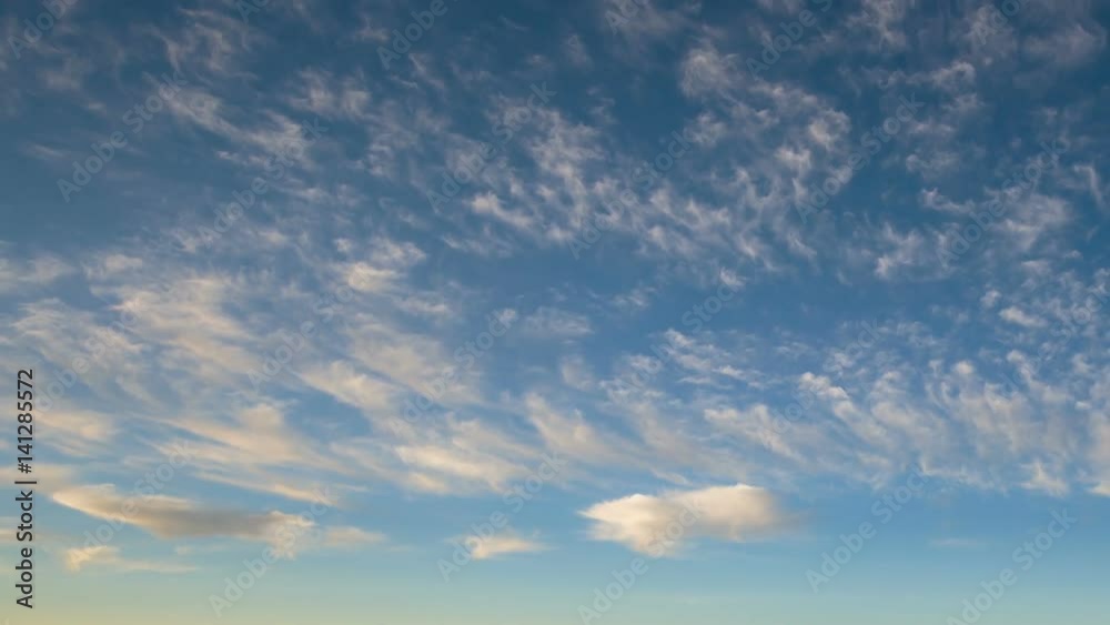 Russia, timelapse. Formation and rapid movement of white clouds of different shapes in the blue sky in late autumn at sunset. Russia, timelapse. Formation and rapid movement of white clouds of different shapes in the blue sky in late autumn at sunset.
