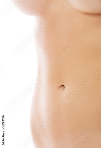 Slim nude young woman belly