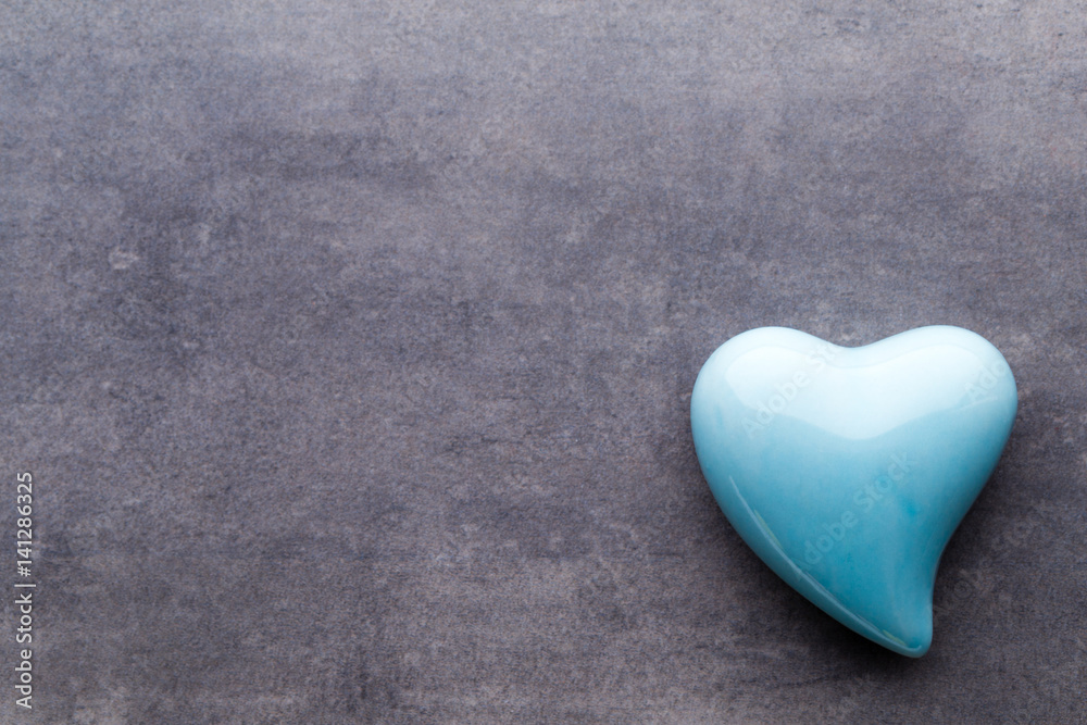 Colored heart on the gray background. View from above. Flat lay. Colored heart on the gray background. View from above. Flat lay.
