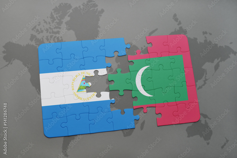 puzzle with the national flag of nicaragua and maldives on a world map ...