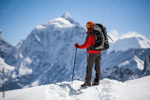 Trekker is walking by Renjo La pass in Everest region