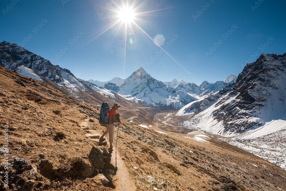Trekker in Khumbu valley in front of Abadablan mount on a way to Everest Base camp