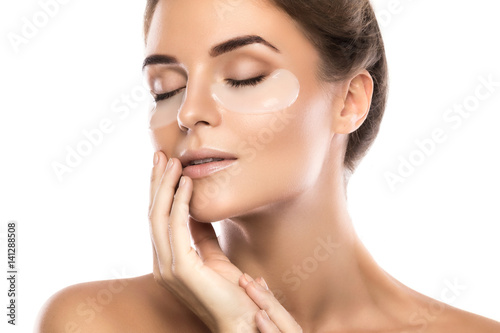 Print op canvas Woman with collagen pads under her eyes
