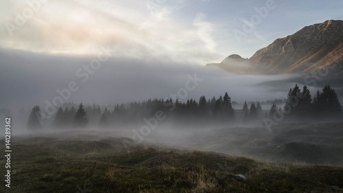 Panorama of a misty autumnal afternoon in the mountains