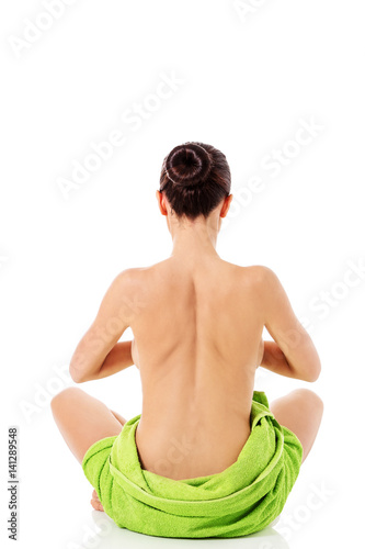Young nude woman with towel practicing yoga, isolated on white.