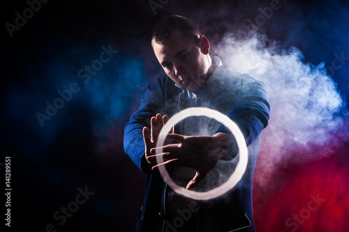 Man shows tricks with smoke...