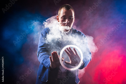 Man shows tricks with smoke...
