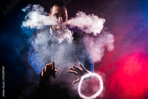 Rings of smoke. Tricks with electronic cigarettes.