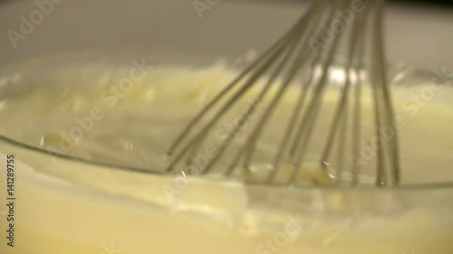 View of manual stirring dough for dessert photo