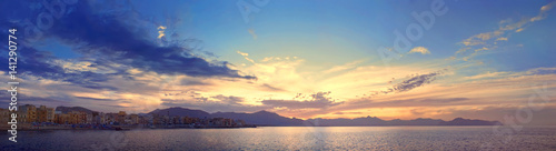 Colorful panoramic view of Sicily coastline with cloudy sunset sky  Mediterranean sea