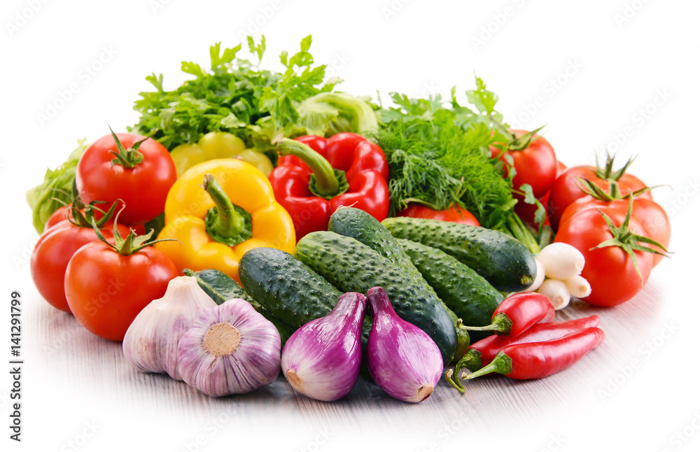 Variety of fresh organic vegetables isolated on white Variety of fresh organic vegetables isolated on white