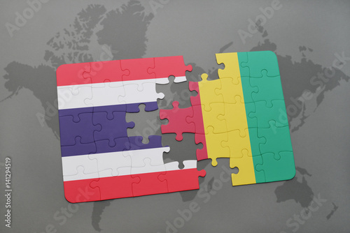 puzzle with the national flag of thailand and guinea on a world map