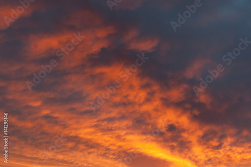 Fiery vivid sunset sky clouds © Juhku