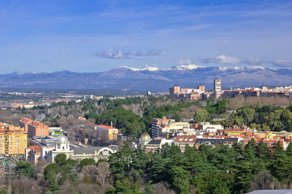 Aerial view of Madrid with Guadarrama Mountains on background