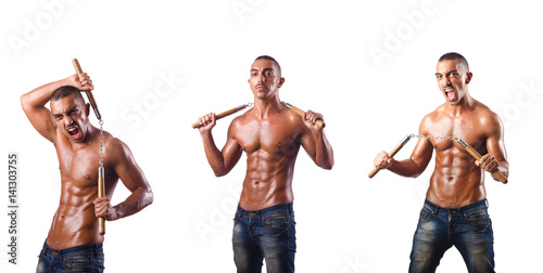 Martial arts warrior with nunchucks on white