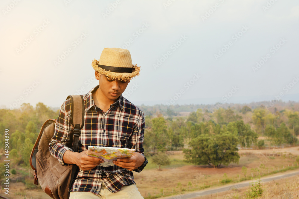 Happy Asian hipster man backpack in nature background, Relax time on holiday concept travel , color of vintage tone and soft focus Happy Asian hipster man backpack in nature background, Relax time on holiday concept travel , color of vintage tone and soft focus
