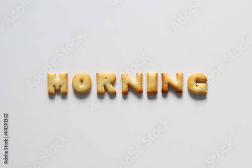 An inscription from the cookies on the white background. Text – morning.