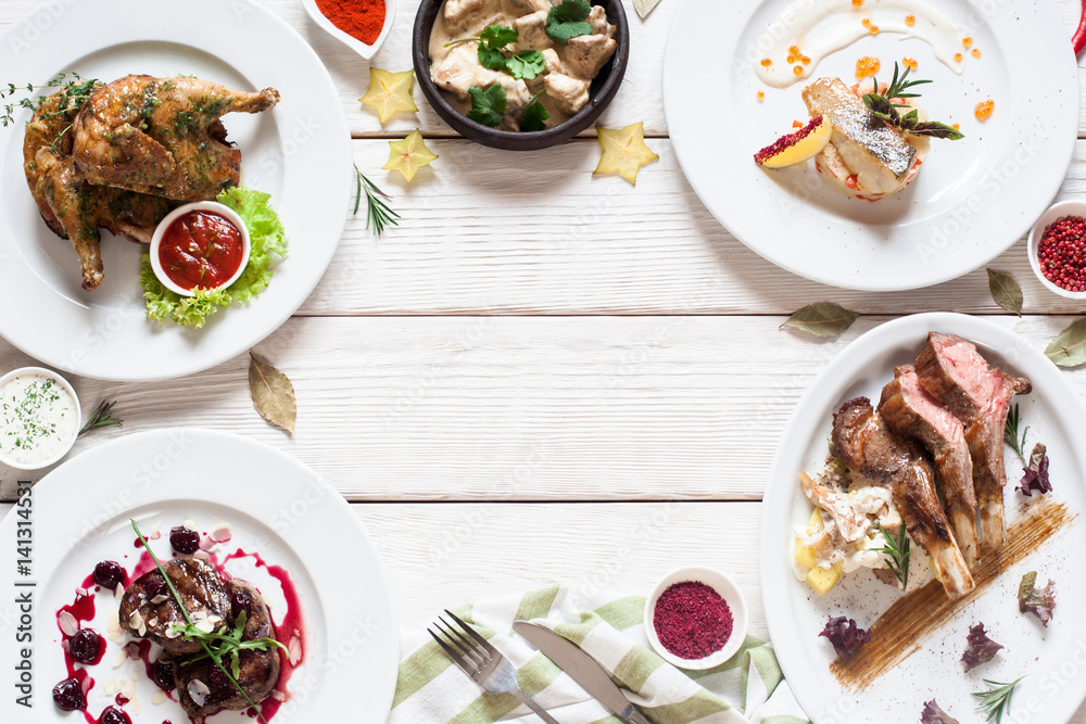 Appetizing frame of restaurant meals flat lay. Top view on assortment