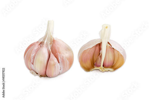 Two garlic bulbs on a light background
