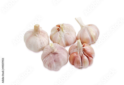 Several garlic bulbs on a light background