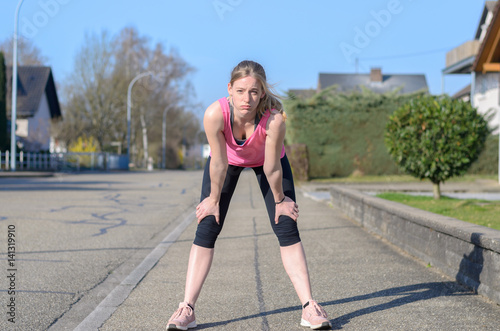 Fit young woman pausing for a break