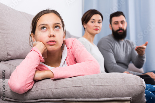 Parents lecturing daughter