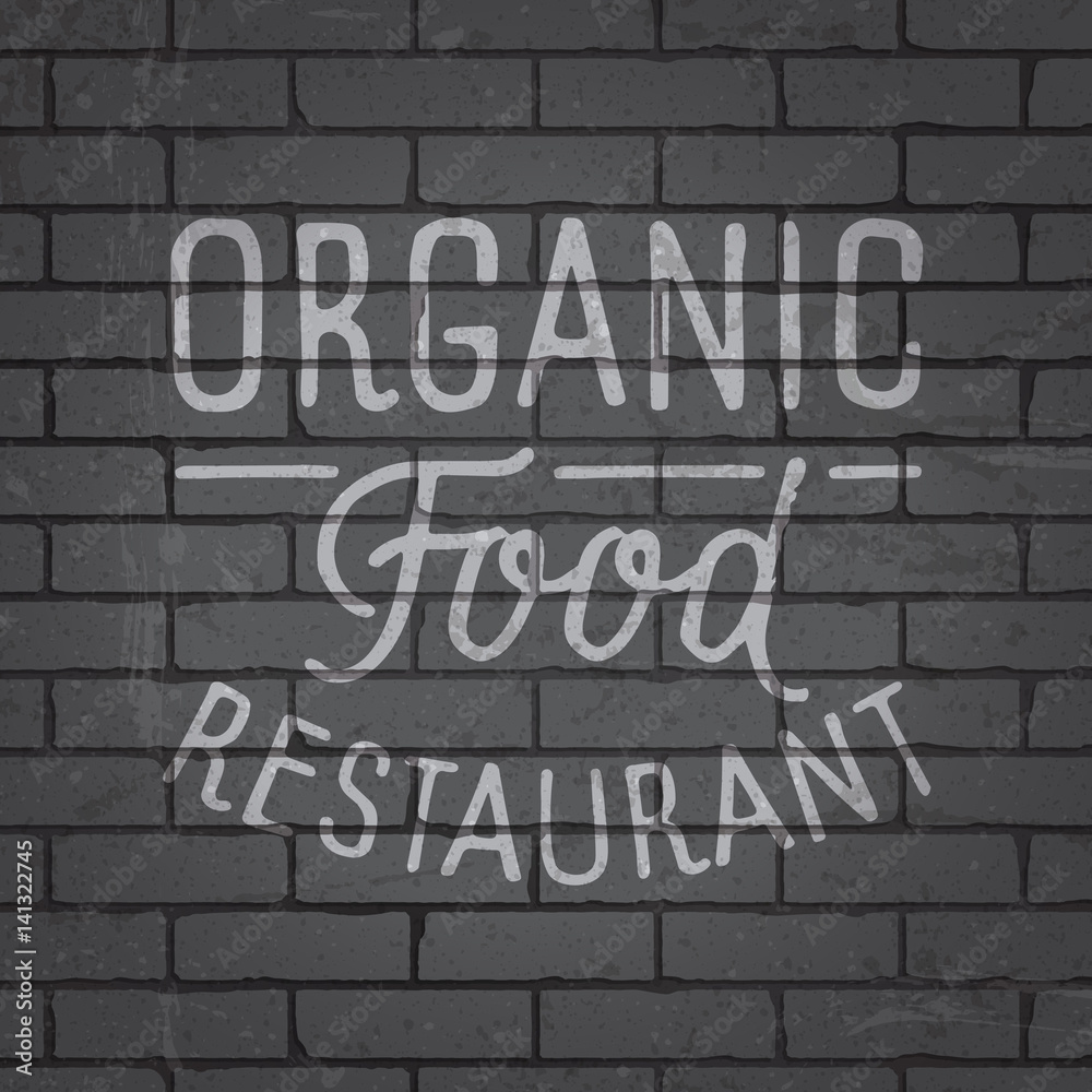 Hand drawn lettering slogan on brick wall background Hand drawn lettering slogan on brick wall background