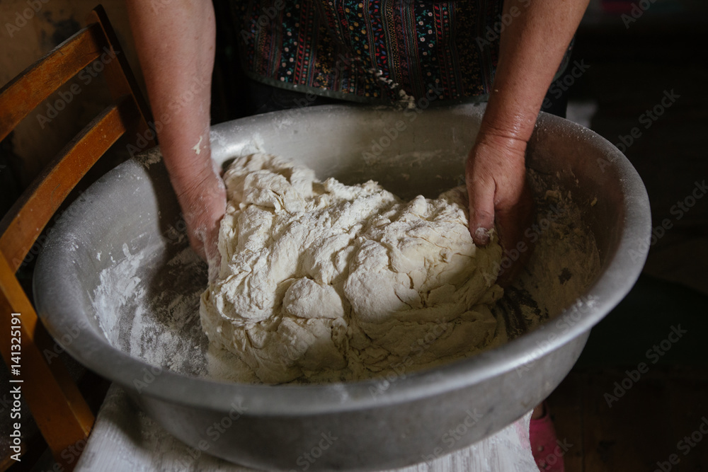 Making dough by female hands at home Making dough by female hands at home