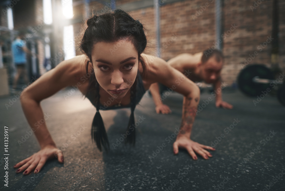 Fitness woman doing push ups Fitness woman doing push ups