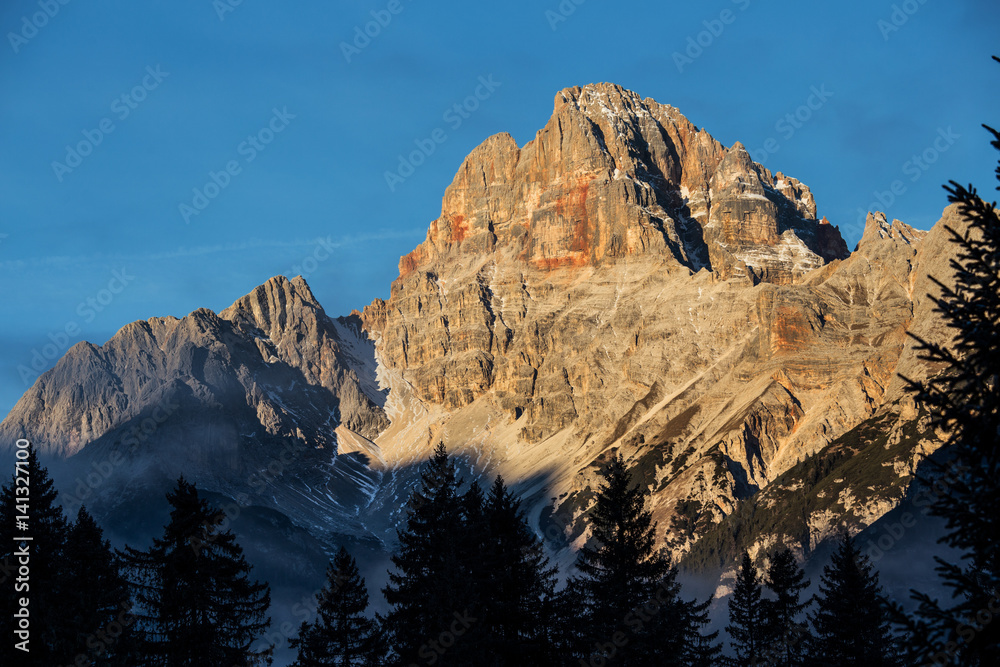 Mountains of the Dolomites sunlit of dawn, Italy Mountains of the Dolomites sunlit of dawn, Italy