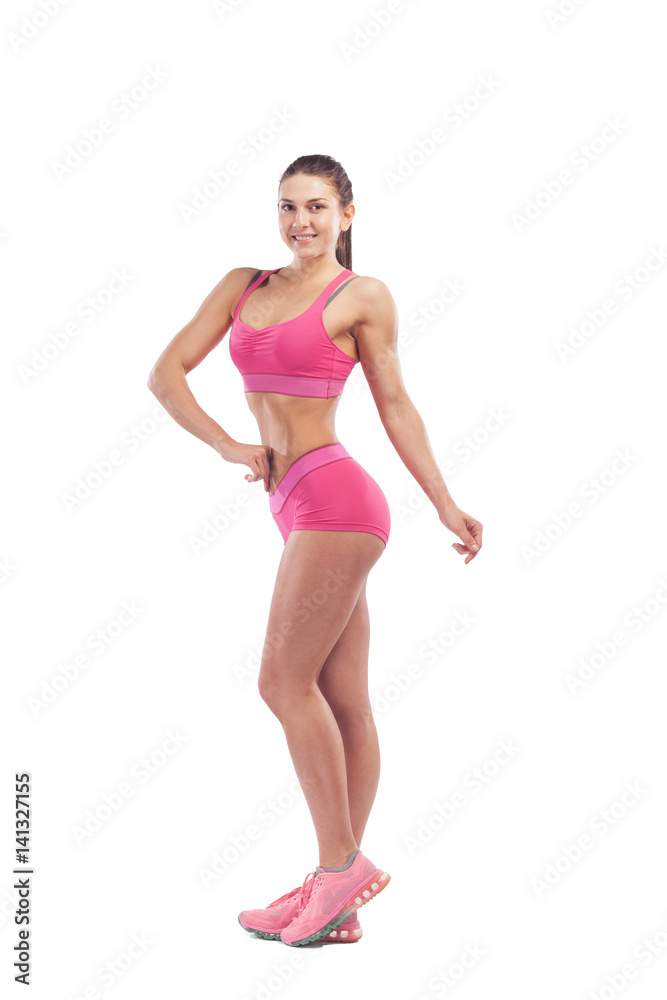 Woman fitness model posing in front of camera and showing her muscles. Isolated white background Woman fitness model posing in front of camera and showing her muscles. Isolated white background