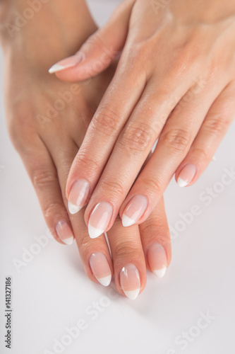 Beautiful woman s nails  french manicure.
