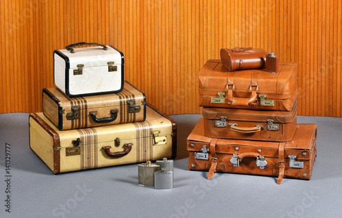 Stacks of Antique Suitcases and Drinking Flasks photo