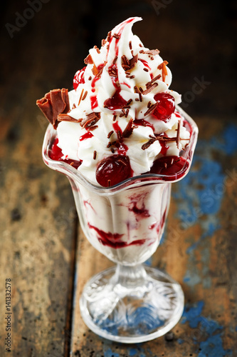 Photography Tasty vanilla ice-cream with cherries
