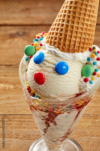 Cute colorful little clown of ice-cream and candy