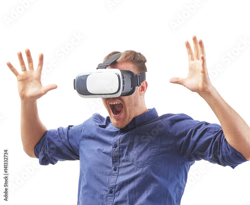 Screaming young man using a VR headset enjoying interactive game with fear emotion and experiencing virtual reality isolated on white background