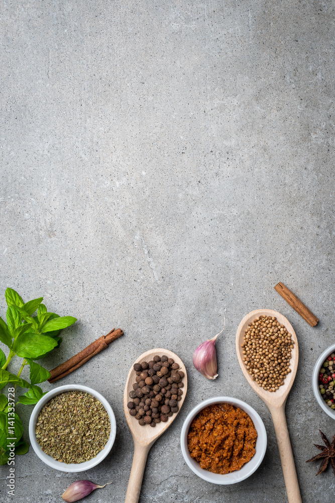 Fresh herbs and spices on gray stone table. Food background Fresh herbs and spices on gray stone table. Food background