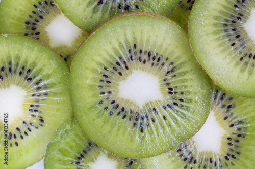 Fresh kiwifruit slices close-up on the table