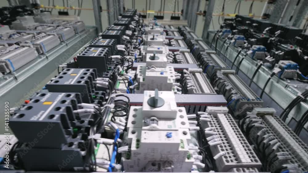 Automatic control system cabinet. Electrical panels, cables, buttons, switches installed. Dolly shot 4K